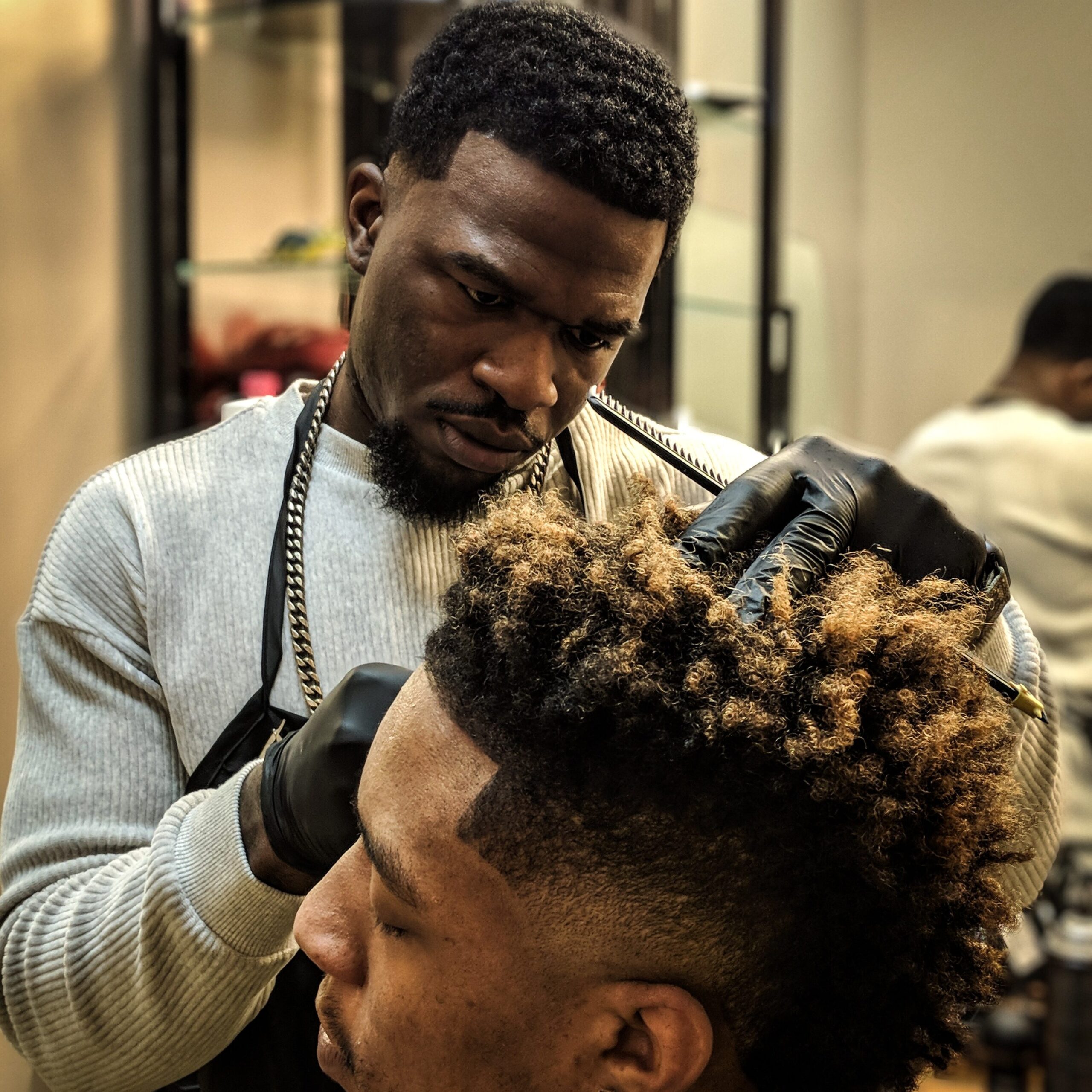 Man getting his hair cut at a salon