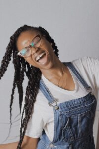 A black woman portraying a lot of positive energy