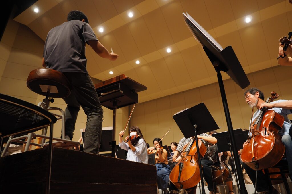 conductor conducting and orchestra