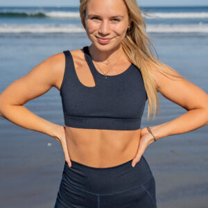 Seaav Founder Mckenna Haaz in the Seaav Cut-out bra and shorts in Midnight color